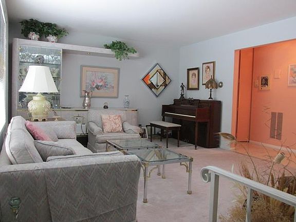 View of Living Room from the Cut Through Staircase