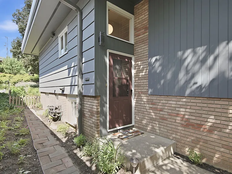 Private front door and path to back yard