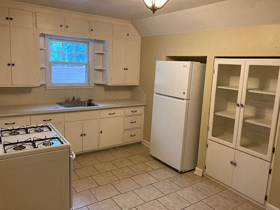 Large kitchen with space for a table.