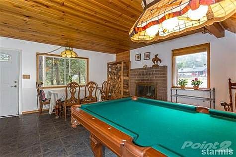 main floor: entry area, dining area, fireplace and pool table
