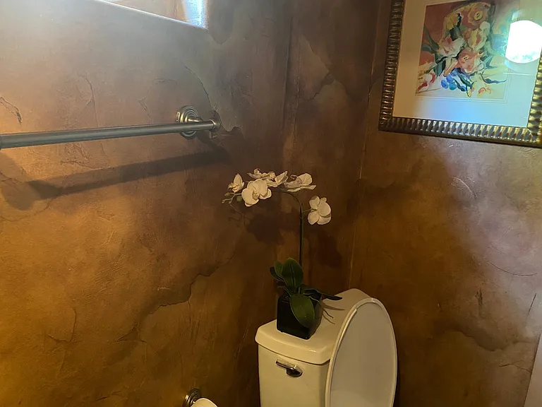 Powder room on the first floor by the laundry room