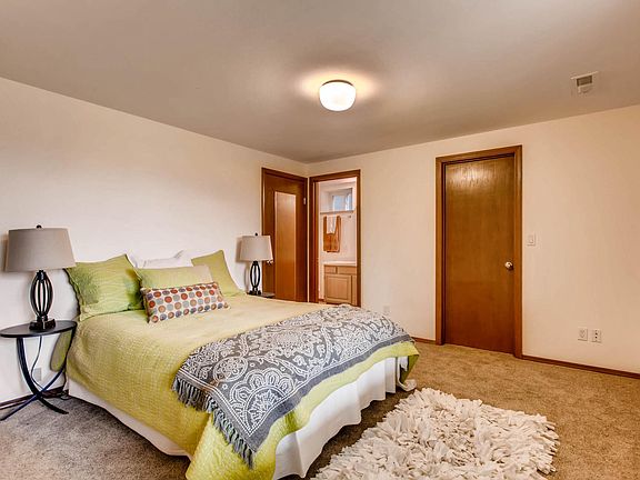 Master bedroom. The door on the right is the walk-in closet. The far door with the mirror is additional storage. The center door is to the full bath.
