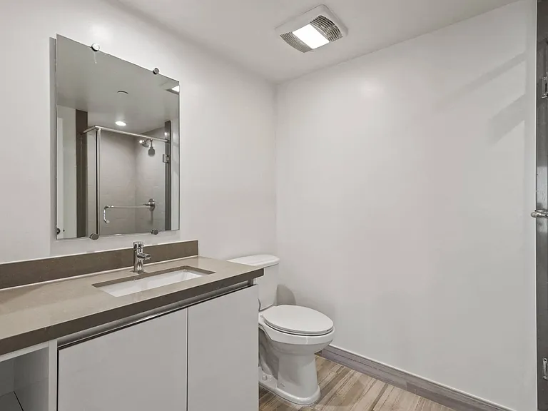 Bathroom with Vanity, Sink, and Toilet