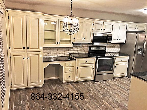 Lots of storage and a desk space in this modern kitchen