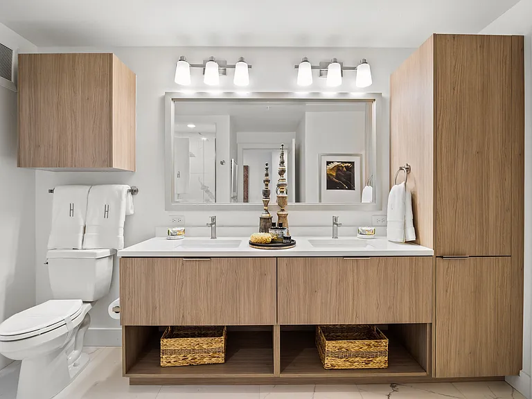 Spa-inspired bathroom offering ample storage space