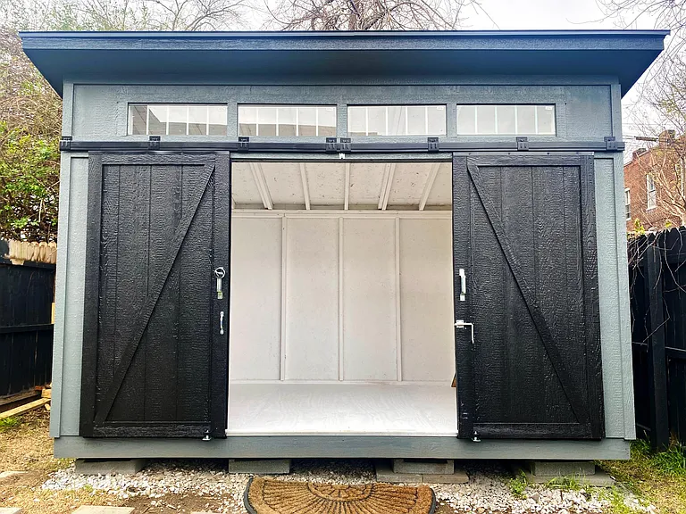 Weather tight 8x12 shed for extra storage.