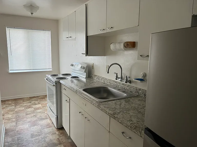 Kitchen with new stainless steal refrigerator