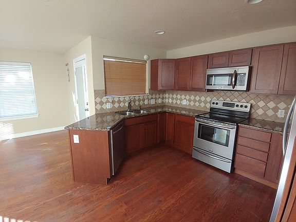 Kitchen with adjacent dining room.