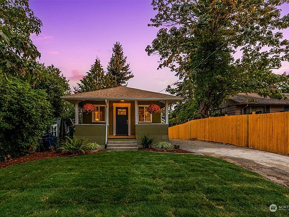 Mature landscaping surrounds the home with brand new sod in front and back yard>