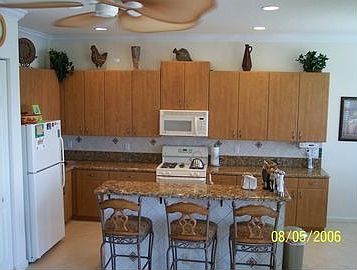 Kitchen with Granite Center Island with Stools