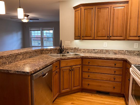 Beautiful Custom Kitchen Cabinets by family owed Barber Cabinets; Breakfast Bar, Over and Under Cabinet Lighting, All Appliances
