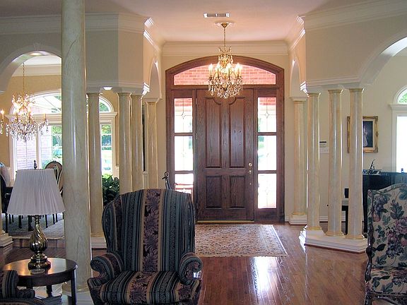 Entry with formal dining on left and formal living on right