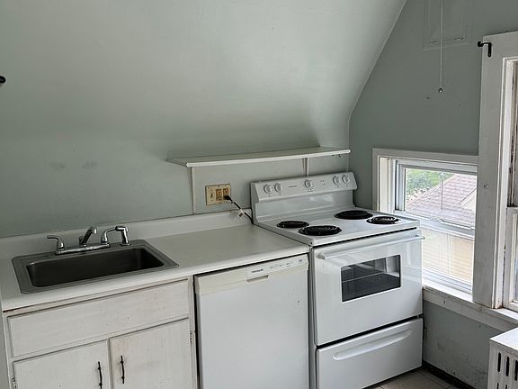 Kitchen includes stove and refrigerator