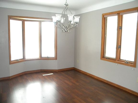 Formal dining room with fresh paint, new flooring, and new ligth fixture