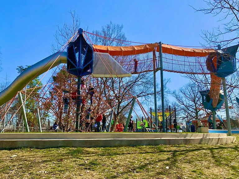 New Fairlington Community Center playground features ziplines, swings, and 20ft high enclosed rope walk. There's also a separate workout area for adults nearby.