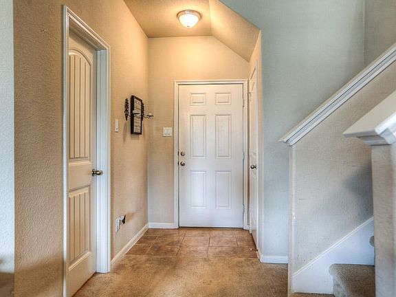 White doors and trim pop against Kilum Beige walls.