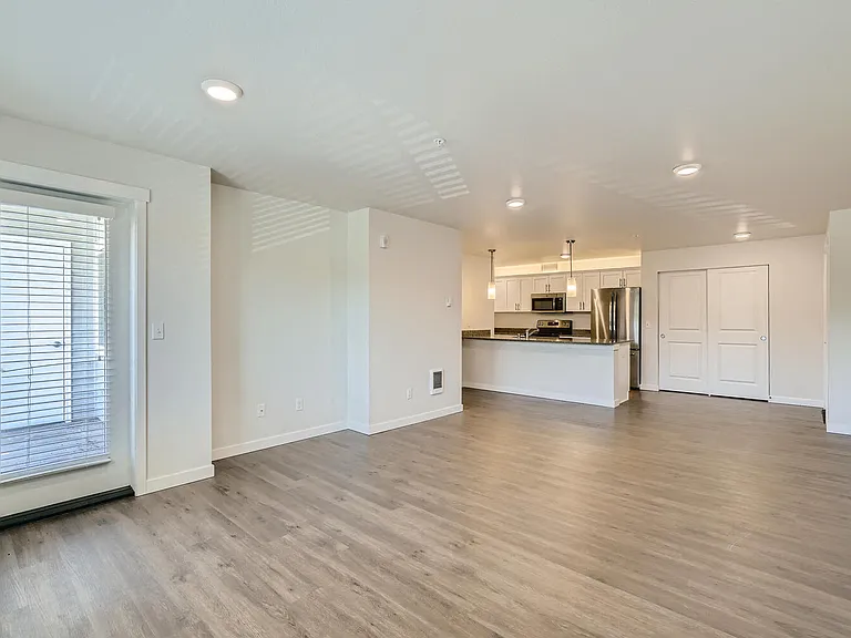 A Standard Living Room and Kitchen at Huntington Place Apartments