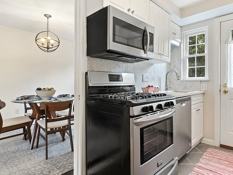 Kitchen, with door to outside deck