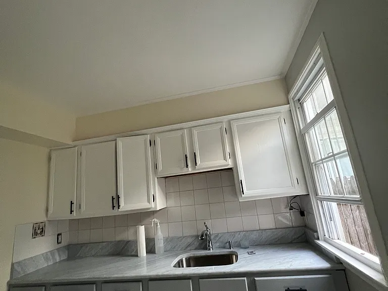 Refaced kitchen cabinets. New countertop.