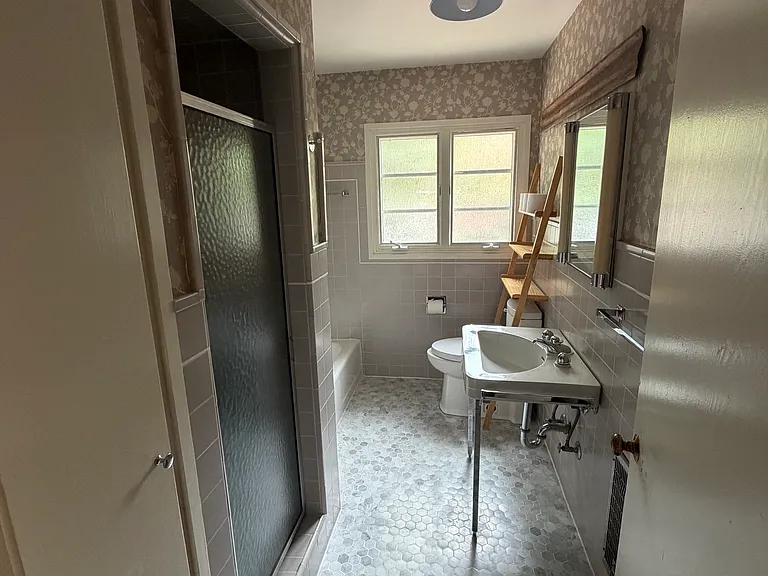 Bathroom with separate shower and tub and storage