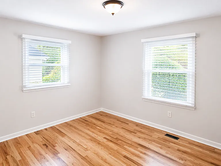 Spacious bedroom with room for king bed + desk"