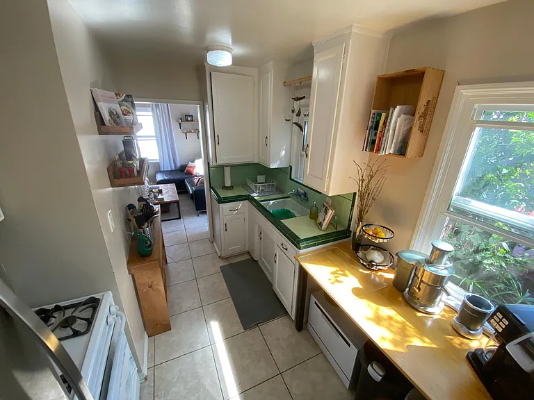 Kitchen set up of tenants who loved to cook. At the far end is the doorway to the living room