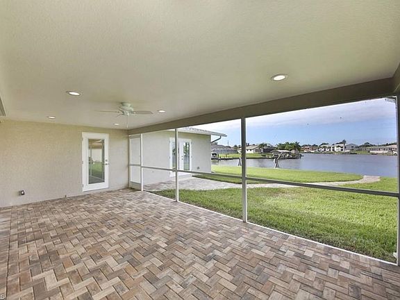 New screened in porch with new pavers. Newly sodded yard with sprinkler system.