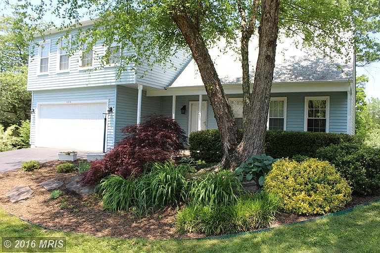 Beautiful landscaping surrounds the home