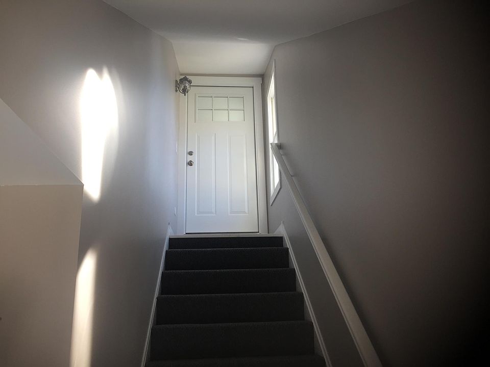Interior stairs leading to the second floor apartment