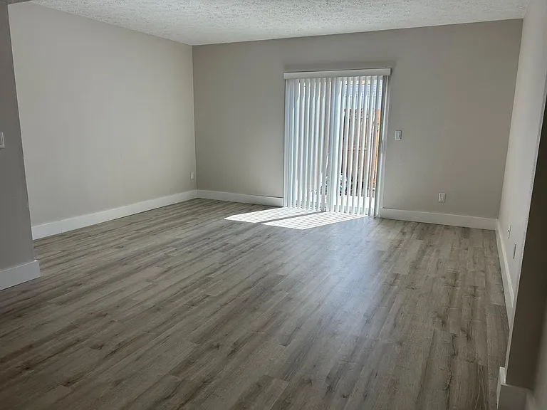 Main Living Room Area with New Energy Efficient Sliding Glass Door that leads to small patio