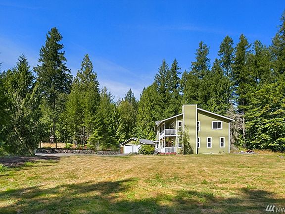 A beautiful wooded setting with fruit trees and garden space. 
