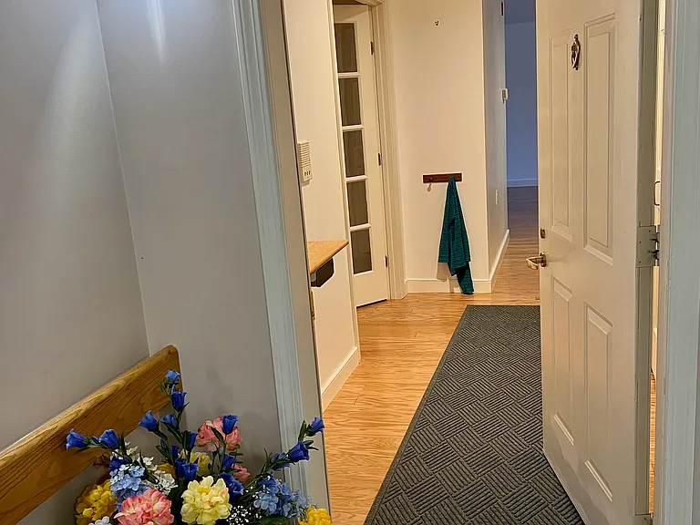View into condo from hallway near elevator