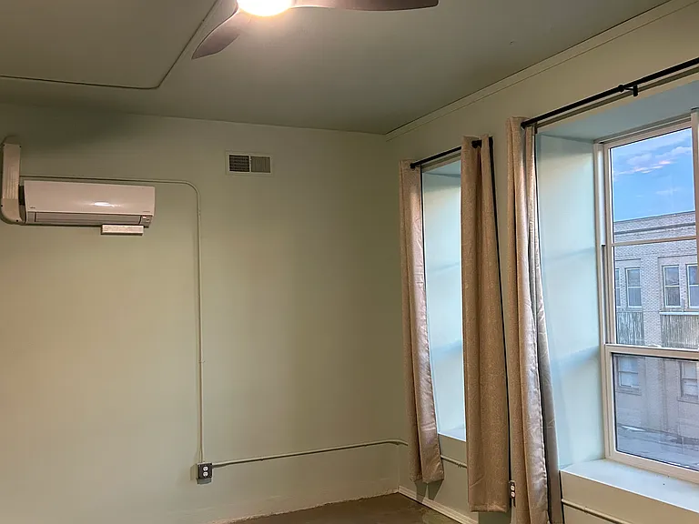 Bedroom #1: AC unit, fan, outlets, and windows