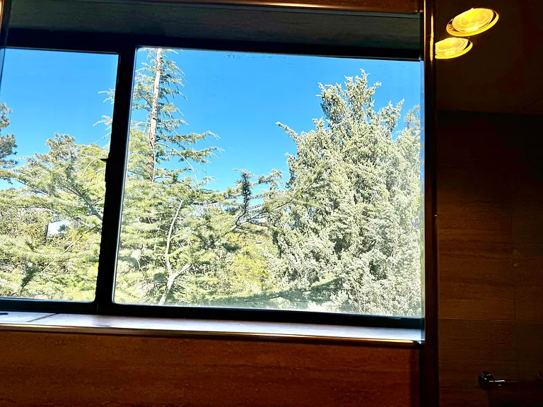 View from master double sinks. Windows slide open for fresh pine air