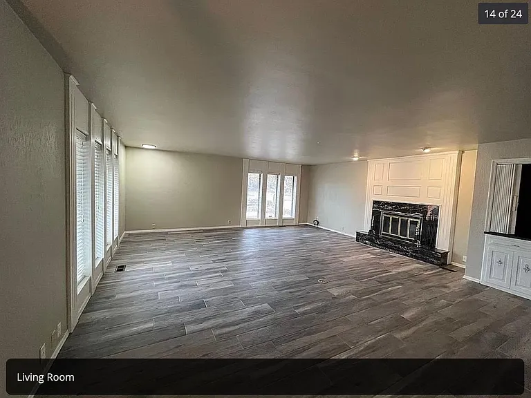huge living room with fireplace and coffee bar