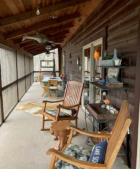 Screened Porch with picnic table.