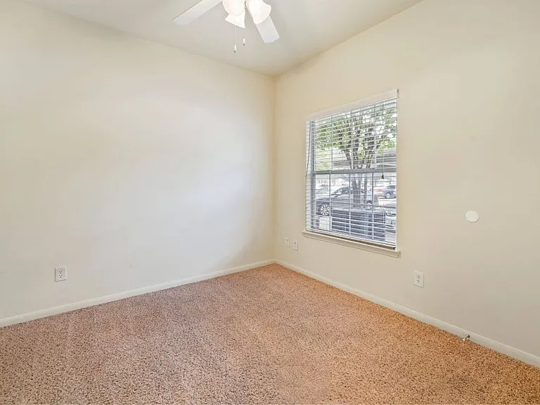 Bedroom with a ceiling fan Stonehaven Apartments in Houston, TX