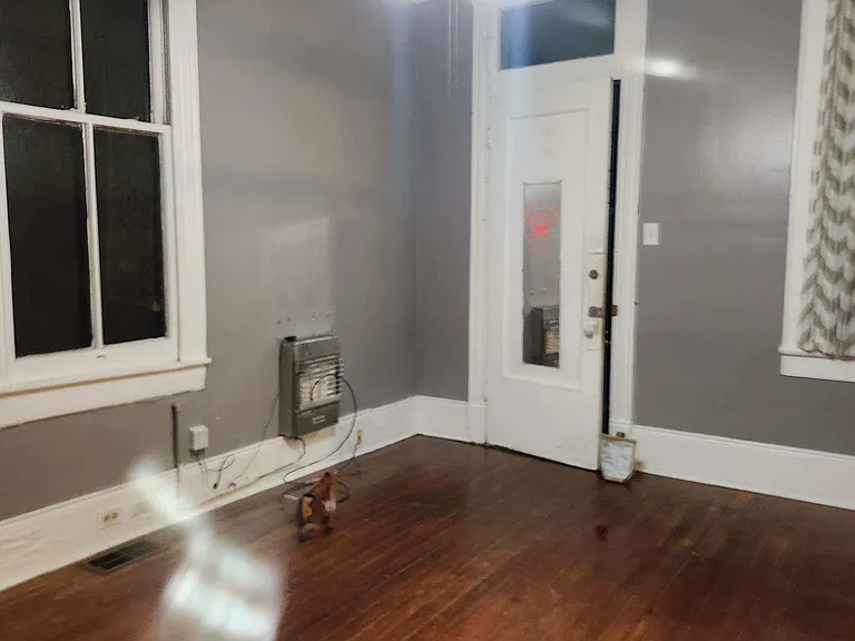 Bedroom 1. Door is to entry screened porch. You can also enter the living dining room from the porch through the main door.