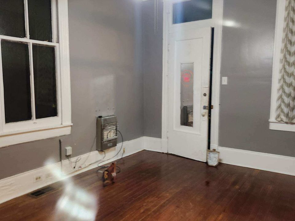 Bedroom 1. Door is to entry screened porch. You can also enter the living dining room from the porch through the main door.