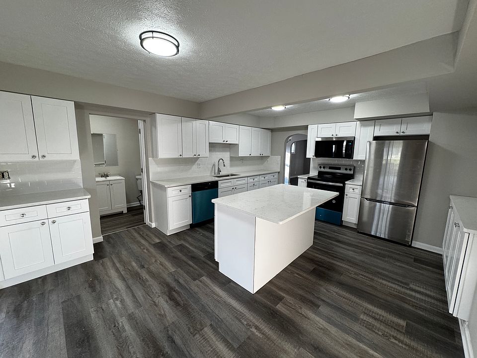 Huge kitchen for entertaining with soft-close cabinets, granite counters, and stainless-steel appliances