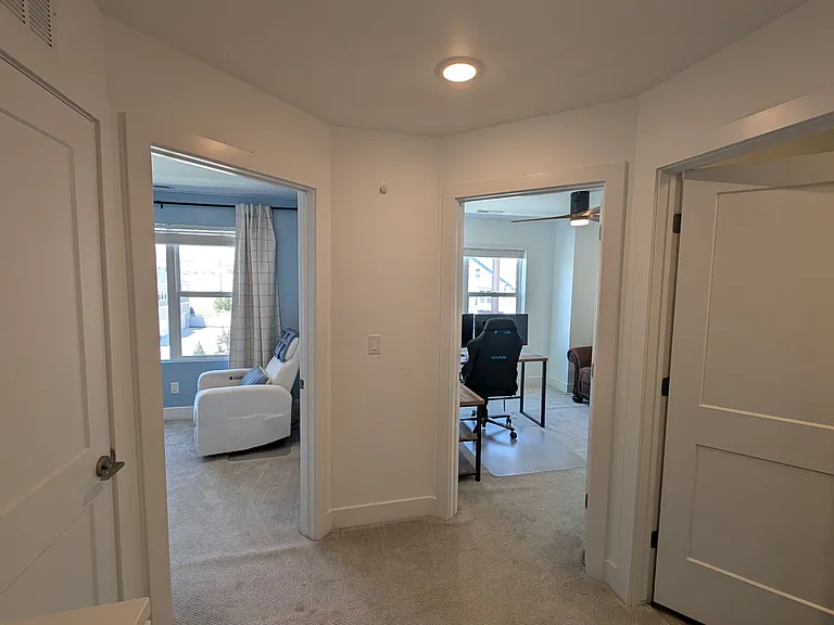 2 additional bedrooms plus another full bathroom on the right and laundry on the left