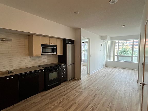 View upon entering the unit. Spacious kitchen and living room