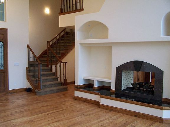 Double sided Fireplace in towering living room!
