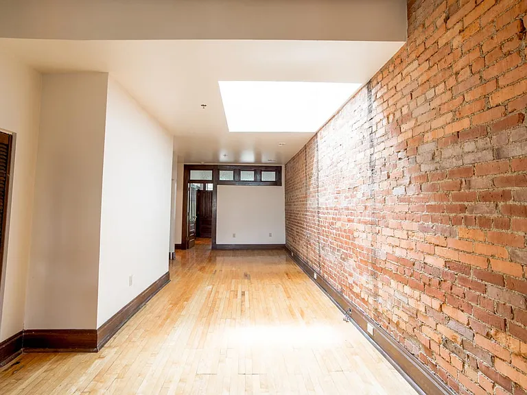 Living Area with Exposed Brick