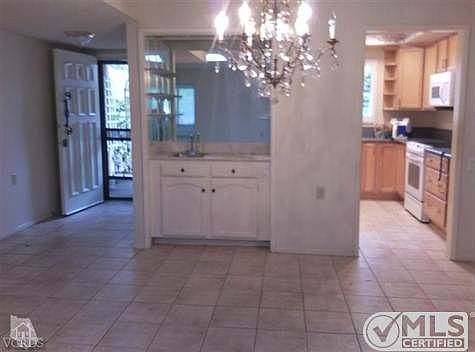 Front entry, wet bar, dining room, kitchen entry from living room