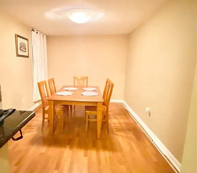 Dining room with furnished table and chairs