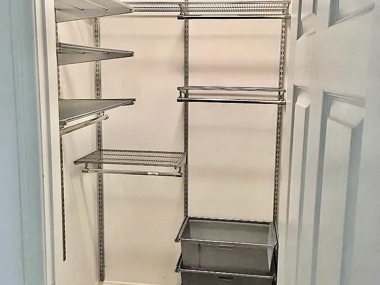 Walk in Closet with Elfa shelving in 2nd bedroom