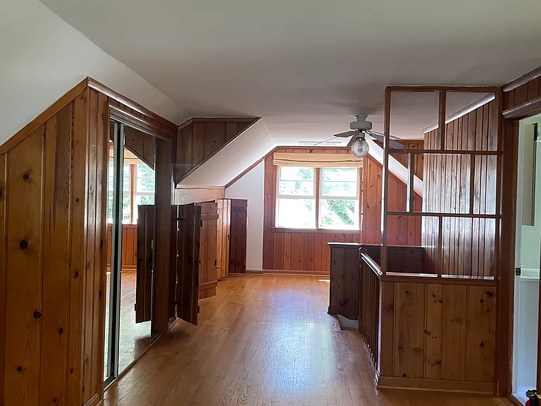 upstairs wood paneling big room with full bathroom, can be used as home office