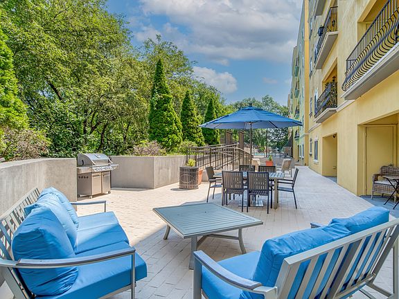 Outdoor patio with grills and plentiful seating