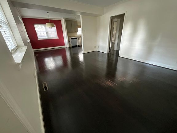 View of the living room and dining room area from the front entrance.